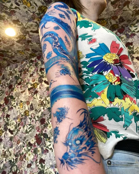 Blue abstract dragon &amp; flowers- my first tattoo by Haruka (Tokyo)