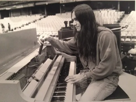 My dad was the piano tuner/technician for many world tours from the 70s to the 90s. Here's some of my favorites, first one is tuning for Paul McCartney in 1989 (this and the sleeping one were taking by Linda McCartney), my dad when he worked with Joni Mitchell, and then some RnR time in Australia!