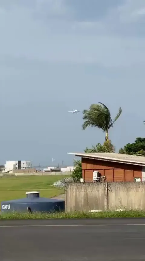 Precise crosswind landing of a LATAM Airbus at Navegantes Airport (SBNF), Brazil, where coastal winds often require advanced "crabbing" techniques to align with the runway