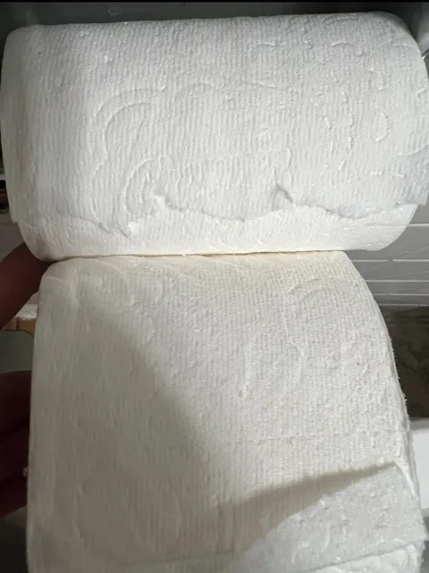 The width difference between Charmin toilet paper. Top is from a 12-pack and bottom from a 32-pack.