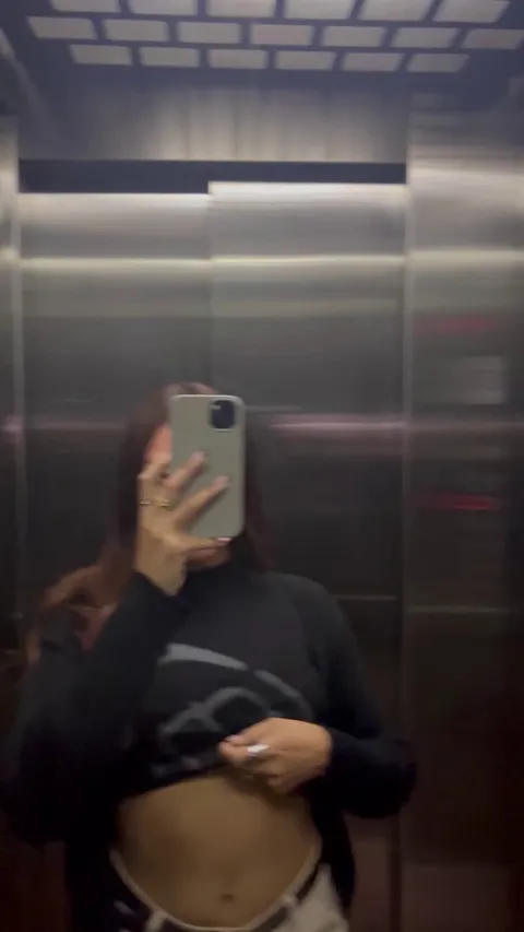Naughty elevator tits reveal