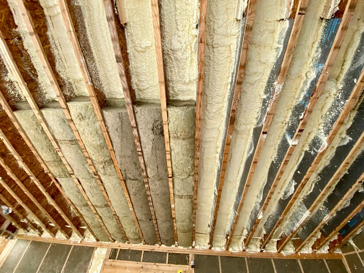 I built a 500 sq ft backyard shed studio for my photography business. I personally handled every phase from design to completion except for concrete, electrical, and HVAC. It's insulated and comfortable year round here in New Hampshire.  Ask me anything!