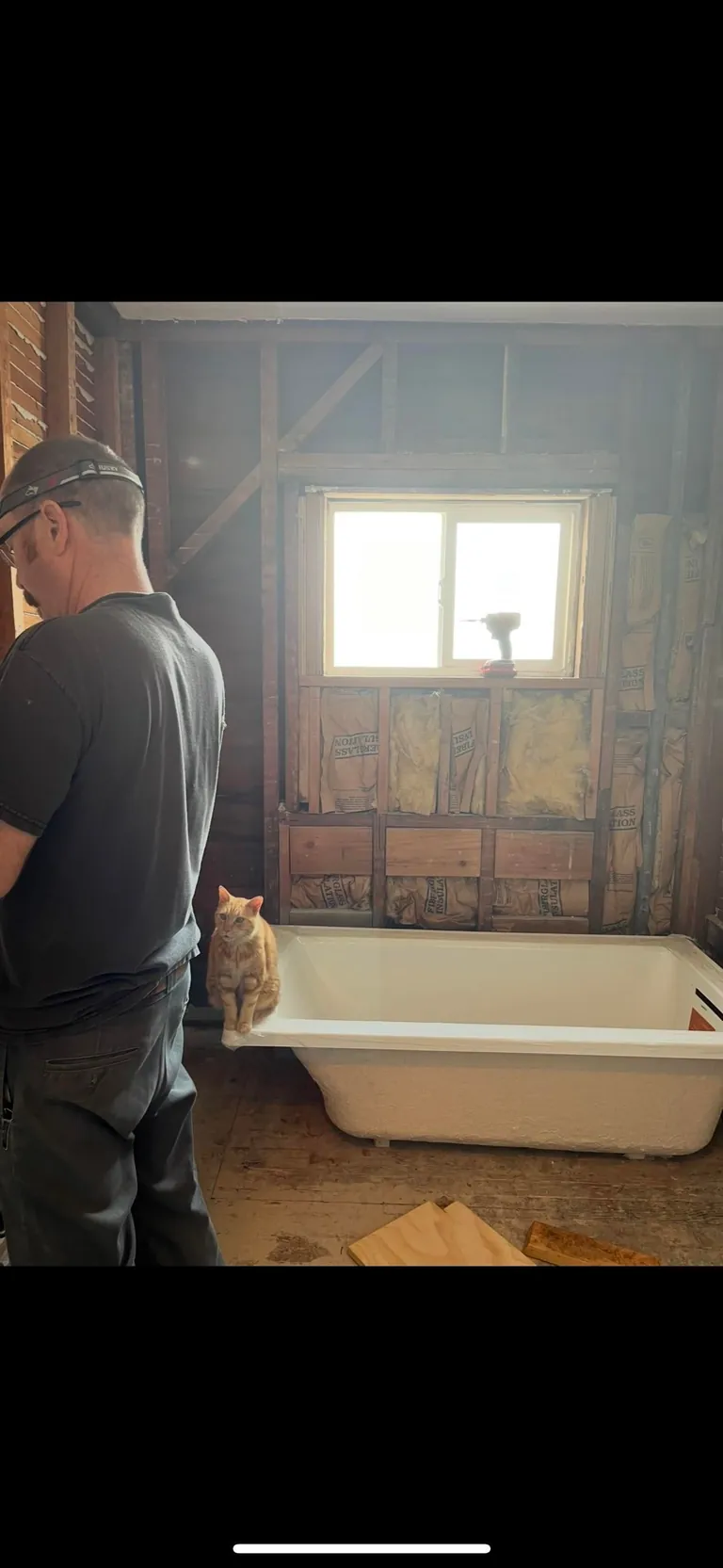My husband and his cat remodeled our bathroom. He’s a tough foreman (the cat)