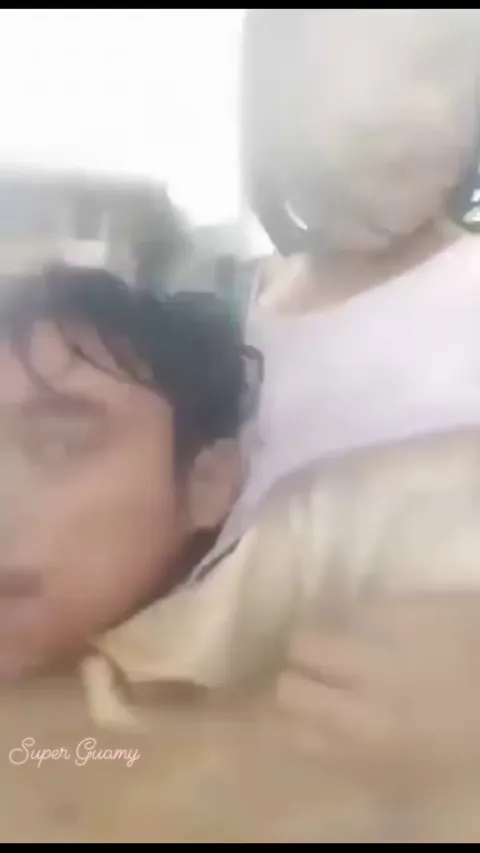 Water is up to his shoulders, but the father is acting calm so his daughter doesn’t get scared