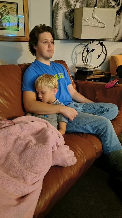 Me sleeping on my uncle's lap when I was a kid and me and my nephew many years later