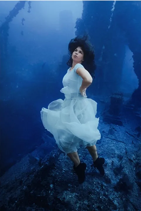 Canadian photographer Steven Haining breaks world record for deepest underwater photoshoot at 163ft - model poses on shipwreck WITHOUT diving gear