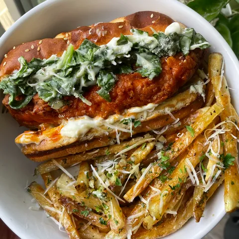 [Homemade] Fried buffalo chicken sandwich topped w/ caesar salad + garlic parmesan fries