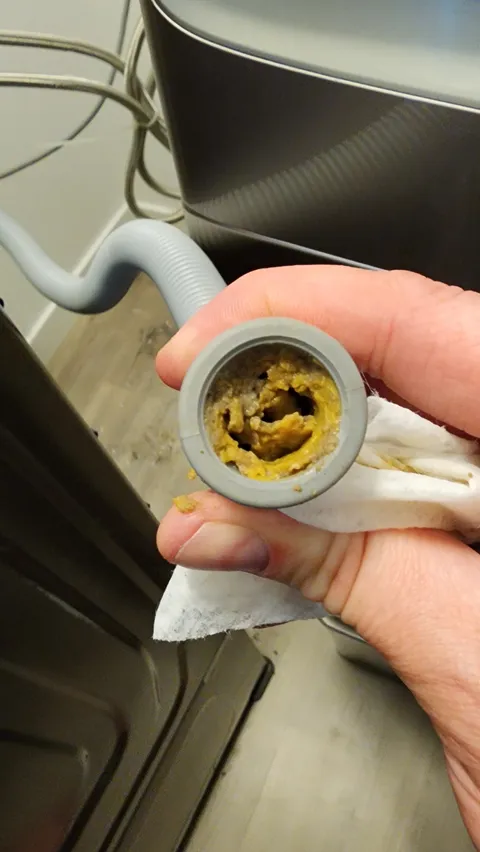 What's going on with my washer discharge hose and how can I prevent it in the future?