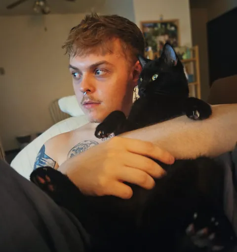 Louie loves to catch up on his TV shows every night but he needs me to hold him steady because he has CH. He's also deaf so subtitles stay ON