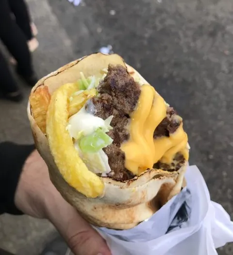 A lebanese cheese burger, basically chopped cheese burger with coleslaw, mayo and fries wrapped in lebanese pita bread. A popular street food in my country that is yummy, sloppy and cheap. Nothing fancy, nothing sophisticated, just a cheap and filling meal for the hard times.