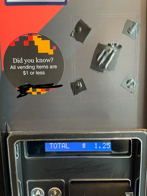 This vending machine at my office lies about prices