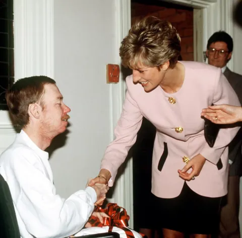 This photo captures the moment Princess Diana shoke hands with a AIDS patient ungloved which challenged the stigma and fear surrounding AIDS at the time. (1987)