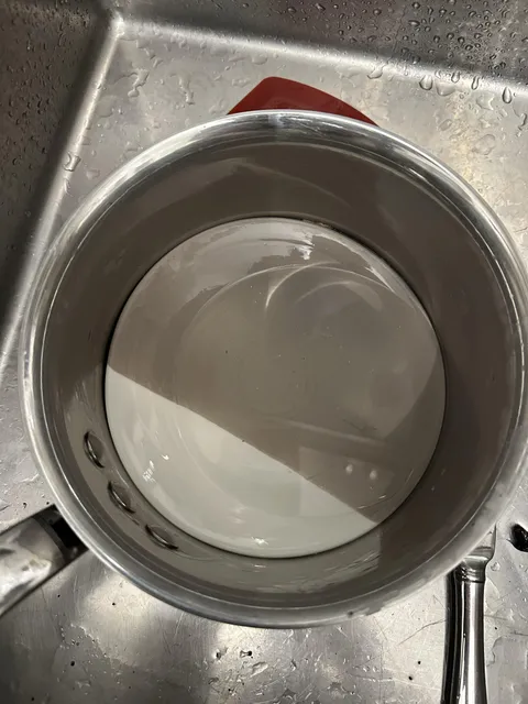 My wife put a small plate in our pot and now it’s jammed