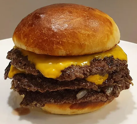 [Homemade] Triple smashed burger with cheese, onion and a freshly baked potato bun