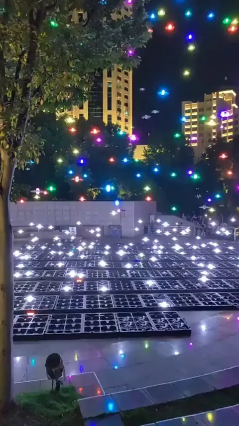 Drones returning to their cradles/cases after a show 