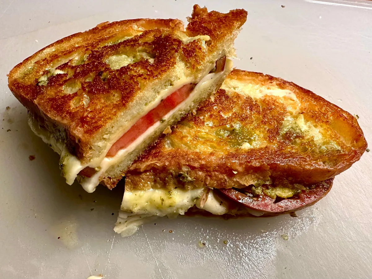 Mozzarella, tomato, and pesto melt on [homemade] bread