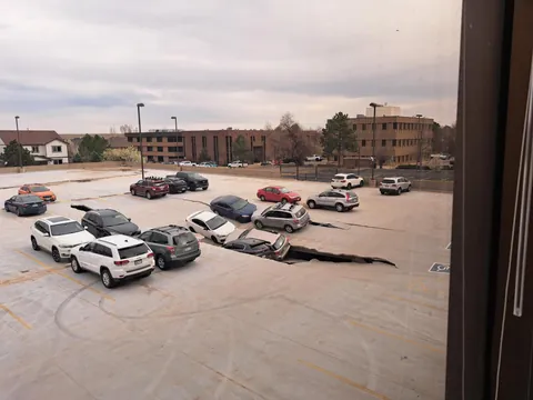 Guess who's car is now stuck in a parking lot collapse