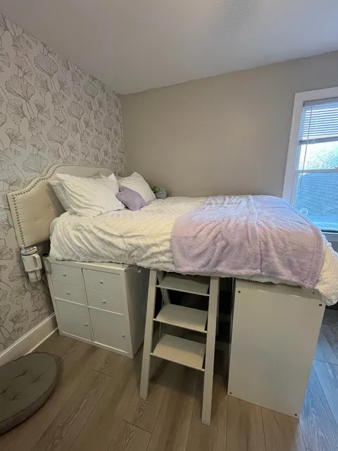 Built a storage bed with thrifted shelves