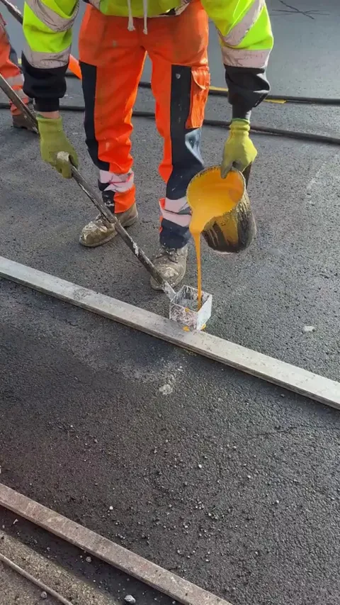 Road letters being painted in the UK