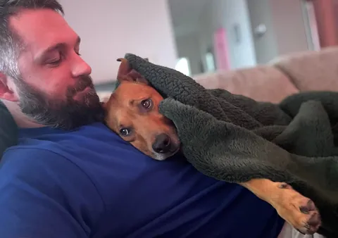 This is my cuddle monster Hector. His chin is on my shoulder as I post this