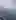 A man captures a Brocken spectre as his shadow appears in the mountain mist.