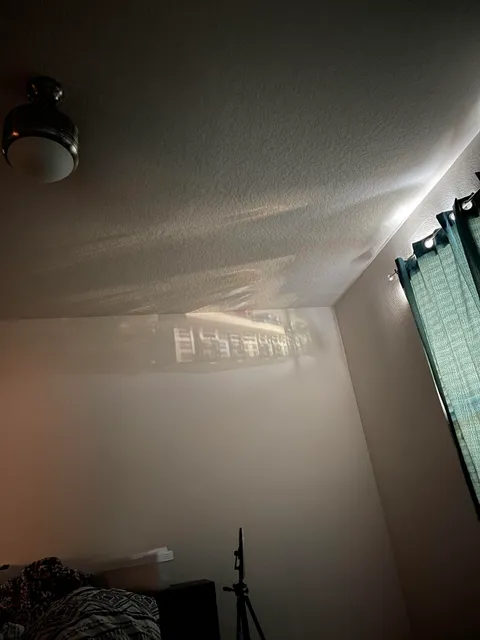 The building across the street reflected into my room