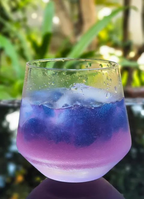 Fresh squeezed lemonade served over ice made with butterfly pea flower tea - my social distancing drink of the day.