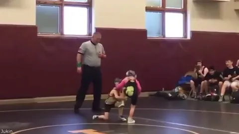Two girls wrestling