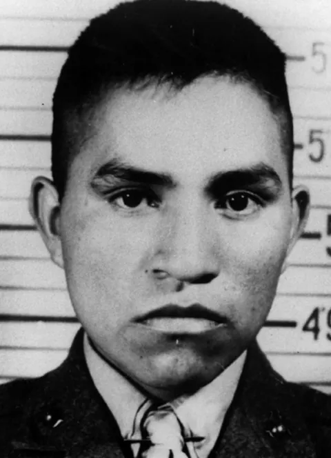 Ira Hayes, a Native American marine immortalized raising the American flag over Iwo Jima, sits in a Los Angeles jail cell (1953). Crippling PTSD and unwanted fame saw Hayes arrested 52 times for public intoxication after the war. He froze to death in the Arizona desert while drunk in 1955.