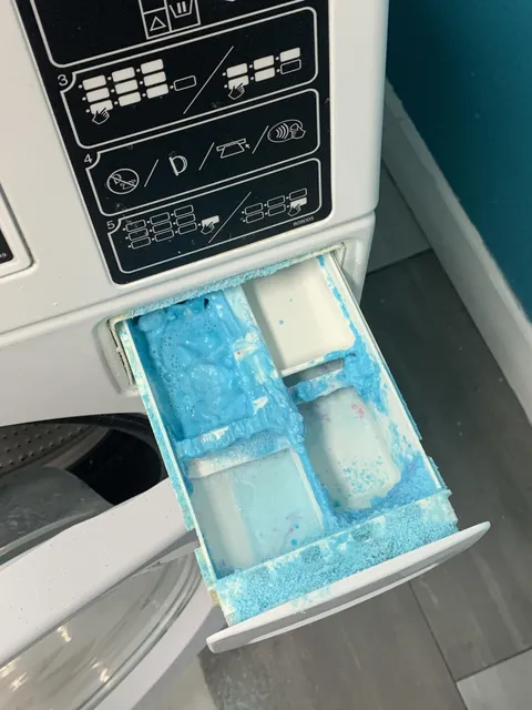 Someone in my complex keeps putting powder in the detergent tray. Every washer looks like this.