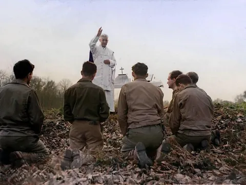 [Colorized] “American soldiers kneel during a Christmas Mass offered by a chaplain on the Italian front” (1943)