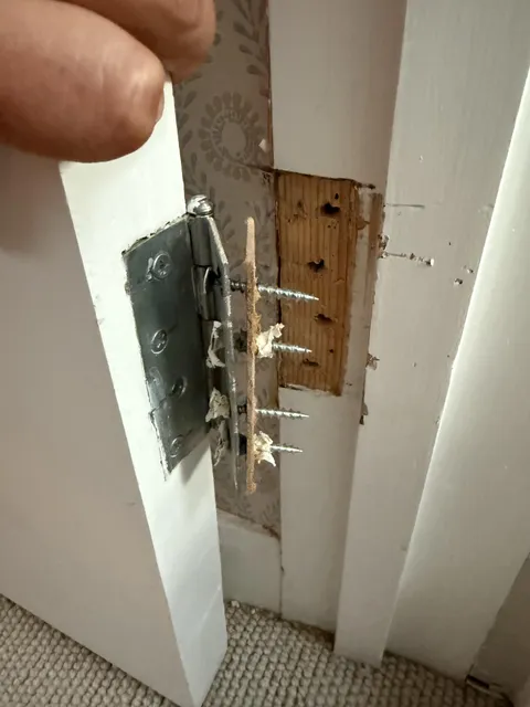 How do I rehang this door when the screws are totally threaded?