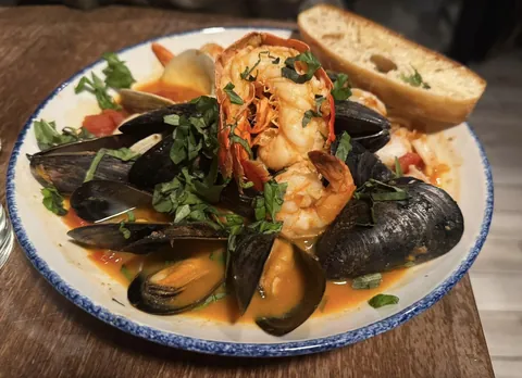 [I ate] This hearty Italian-American seafood stew called Cioppino.