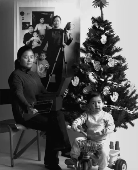 A mother photographs herself and her child over the years, 2001