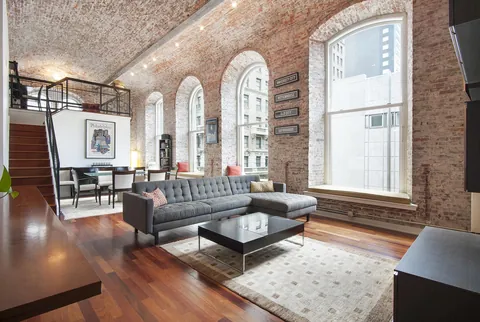 Brick barrel vaulted ceiling and 12-foot windows in this Philadelphia industrial loft [2038 x 1366]
