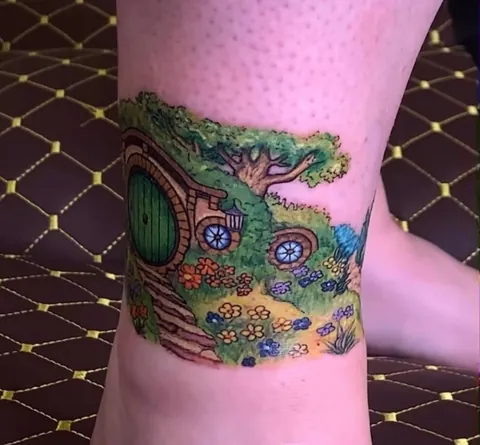 Thought I’d put a towel on my ottoman so that I could rest my new tattoo without getting cat hair on it