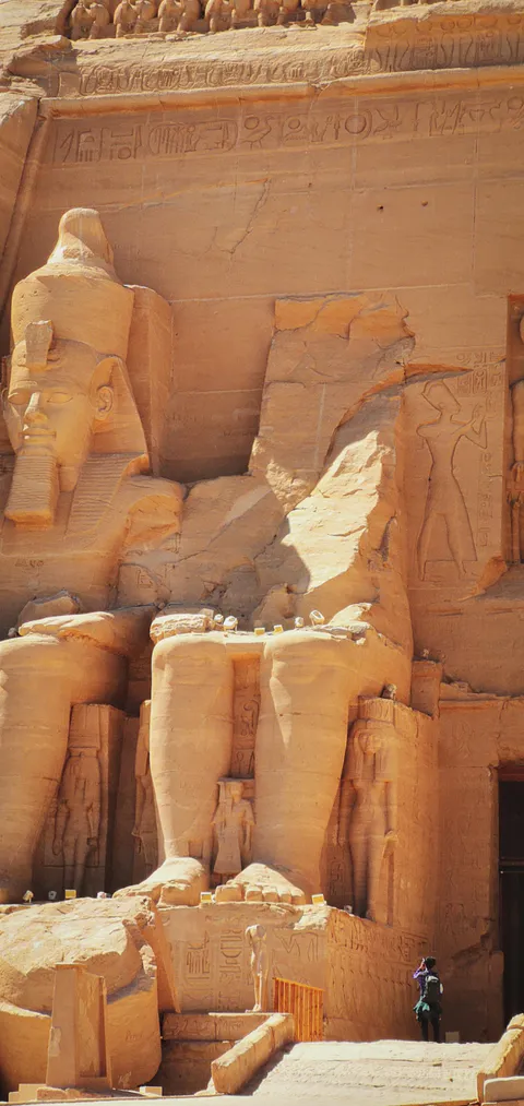 It doesn't quite click how enormous Abu Simbel is until you see a person for scale - Egypt