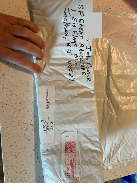 Prepaid $20 for Six Flags souvenir drink cup along with tickets. Park ran out of cups and would not issue refund. HQ offered to mail cup. USPS would only deliver if I paid the difference in postage; carrier could only take cash and had no change.