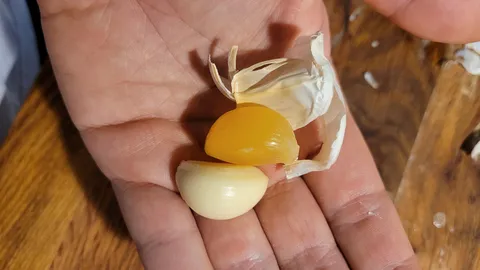 One of my garlic cloves is more yellow and rubbery than the others
