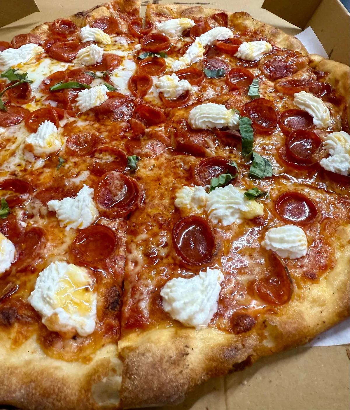 [I ate] Hot Honey Pizza in a Mexican grocery store.