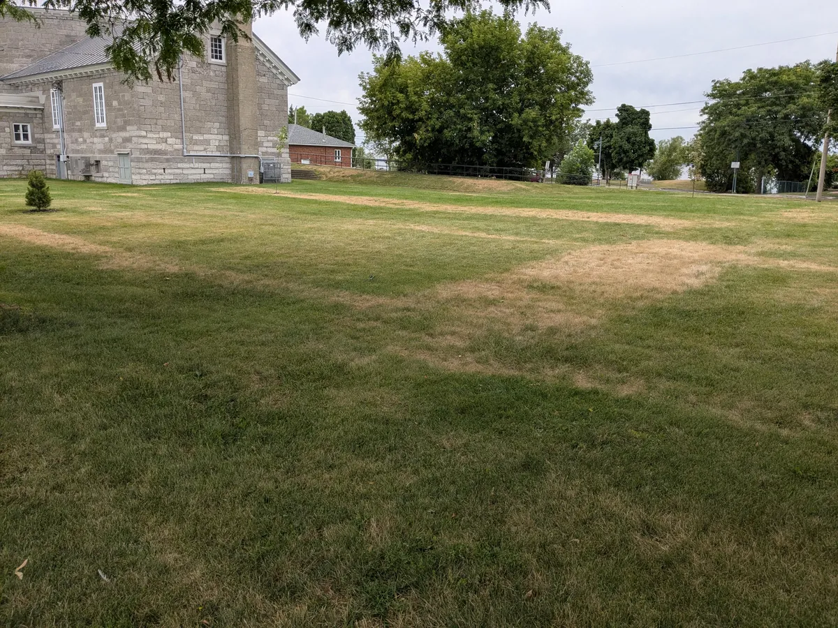 Layout of the crypt under my local church becomes visible when the grass is dry.