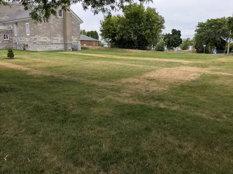 Layout of the crypt under my local church becomes visible when the grass is dry.