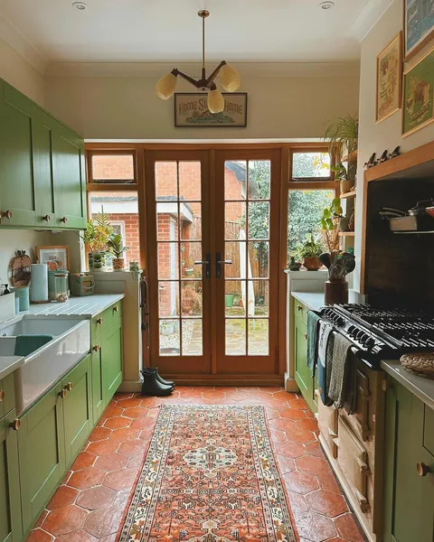 Galley kitchen full of sunlight in a renovated Stockport residence, Greater Manchester, England [1440x1799]
