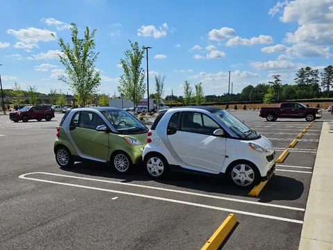 I bought another smart car, can park them both in the same space.