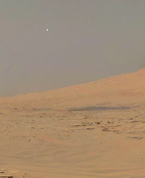 View of the moon Phobos from the surface of Mars.
