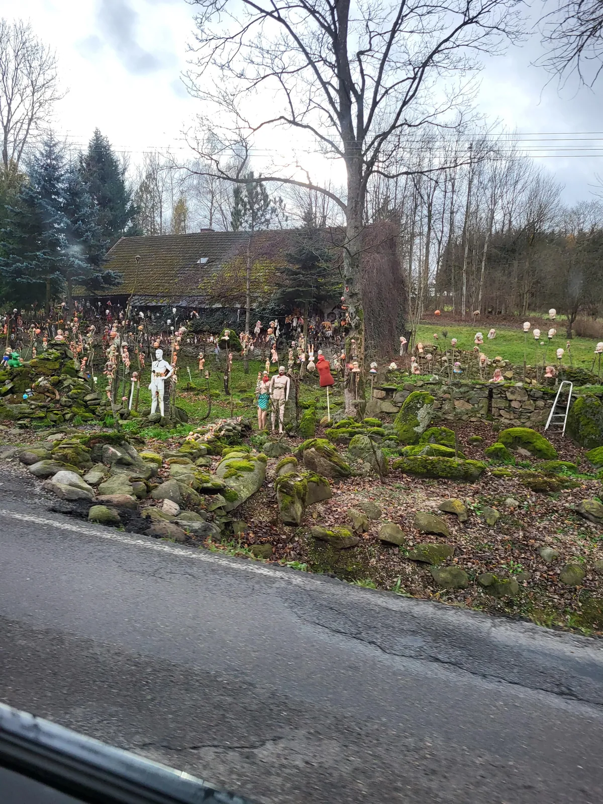 This house near my town. Many years ago it started "only" with hanged babies. Now there are heads on spikes and mannequins too.