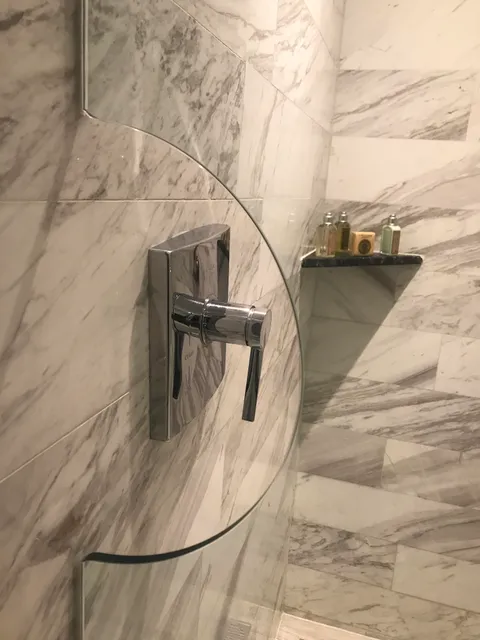 The shower in my hotel has a little cutout so you can turn it on before getting in.