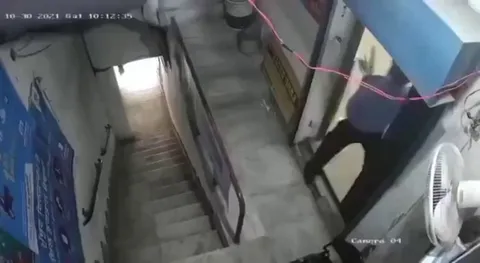 Security guard bravely defends a gold loan company in India.