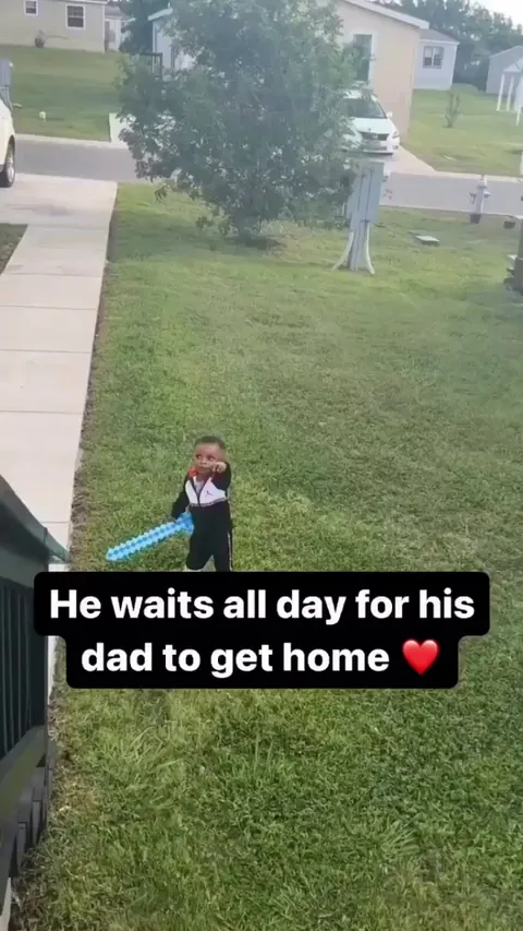 Lil man waited all day for his dad to come back home.