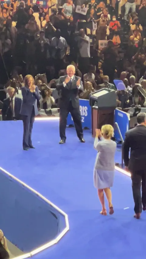 Kamala and Tim meeting their spouses after the rally 